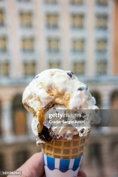 pralines & cream and stracciatella ice cream cone - chocolate chip ice cream stock pictures, royalty-free photos & images