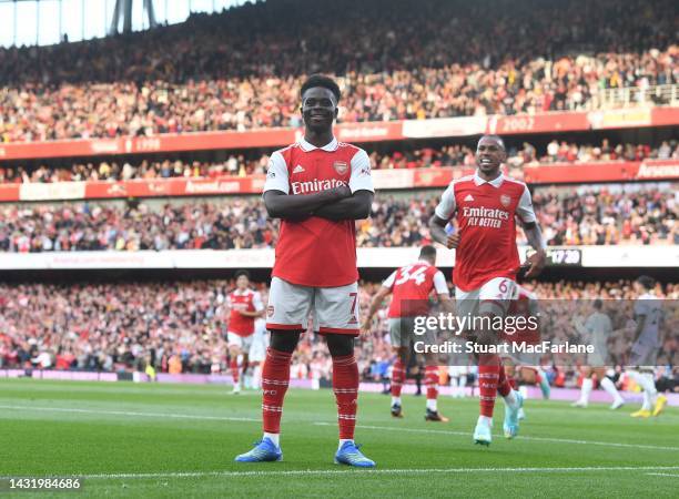 Bukayo Saka celebrates scoring the 2nd Arsenal goal during the Premier League match between Arsenal FC and Liverpool FC at Emirates Stadium on...