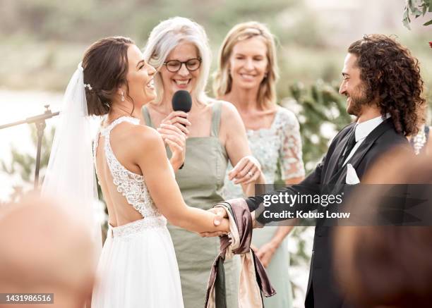 mother at a wedding doing a speech for bride and groom, smiling and laughing together. wedding official, celebration and love with family at the ceremony outdoors. marriage, romance and happy couple - noivo papel em casamento imagens e fotografias de stock