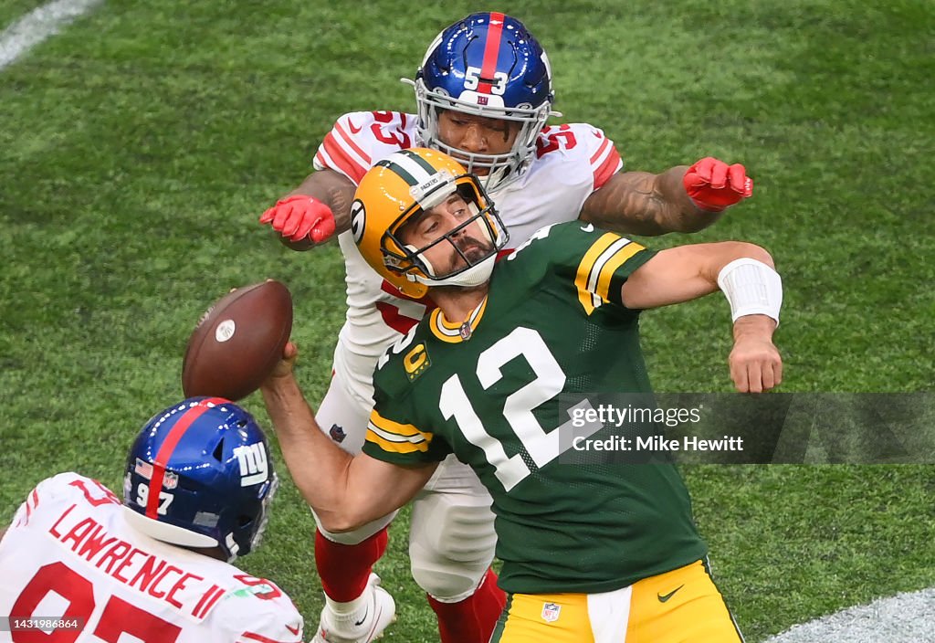 Aaron Rodgers of the Green Bay Packers is sacked by Oshane Ximines of  News Photo - Getty Images