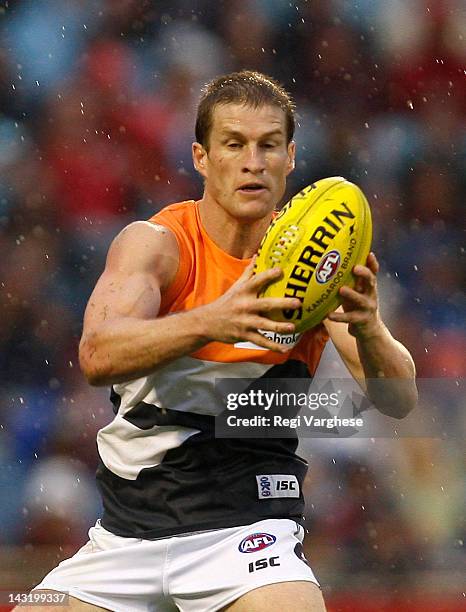 Luke Power of Greater Western Sydney Giants takes a mark during round four of the AFL match played at the AAMI Stadium on April 21, 2012 in Adelaide,...