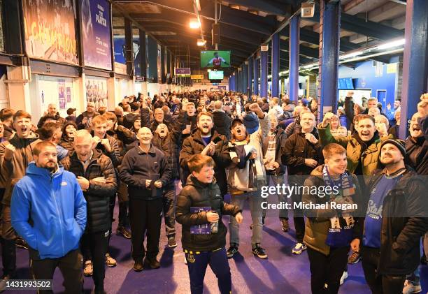 Everton fans react to the Arsenal v Liverpool match prior to the Premier League match between Everton FC and Manchester United at Goodison Park on...