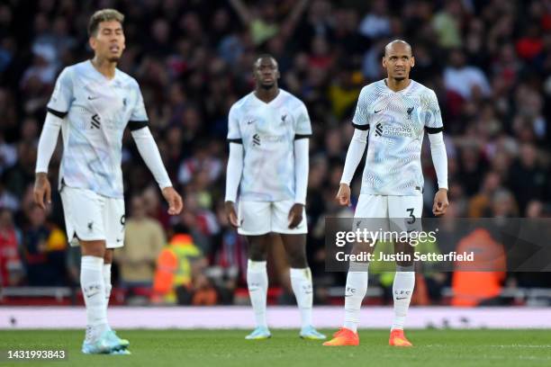 Fabinho of Liverpool looks dejected after Bukayo Saka of Arsenal scored their sides third goal during the Premier League match between Arsenal FC and...