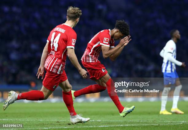 Kevin Schade of SC Freiburg celebrates scoring their side's second goal with teammate Yannik Keitel during the Bundesliga match between Hertha BSC...