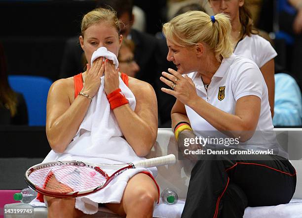 Angelique Kerber of Germany gets instructions from her head coach Barbara Rittner during her match against Samantha Stosur of Australia during day...