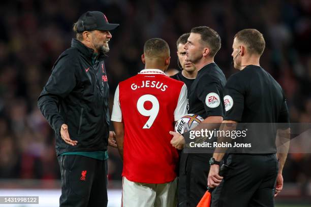 Head Coach Jurgen Klopp of Liverpool has words with Referee Michael Oliver after his sides 3-2 defeat during the Premier League match between Arsenal...