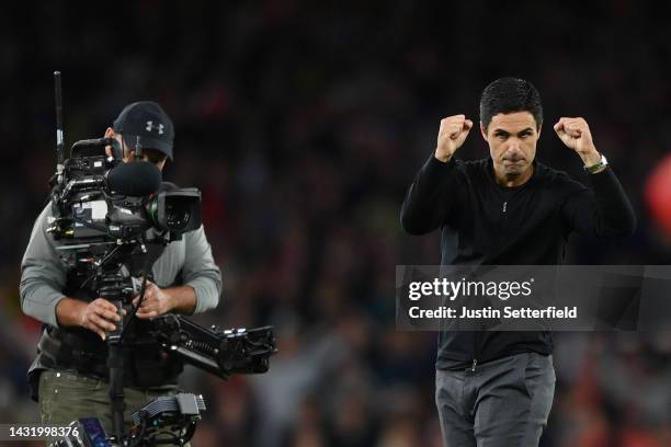 Mikel Arteta, Manager of Arsenal celebrates their side's win after the final whistle of the Premier League match between Arsenal FC and Liverpool FC...
