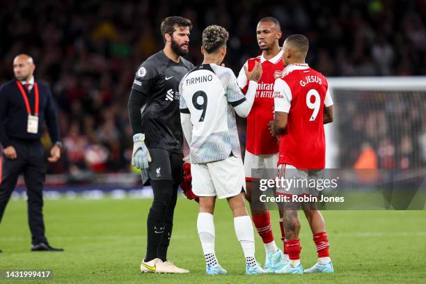 Alisson Becker and Roberto Firminho of Liverpool discuss game with Brazilian team-mates Gabriel Jesus and Gabriel of Arsenal after Arsenals 3-2 win...