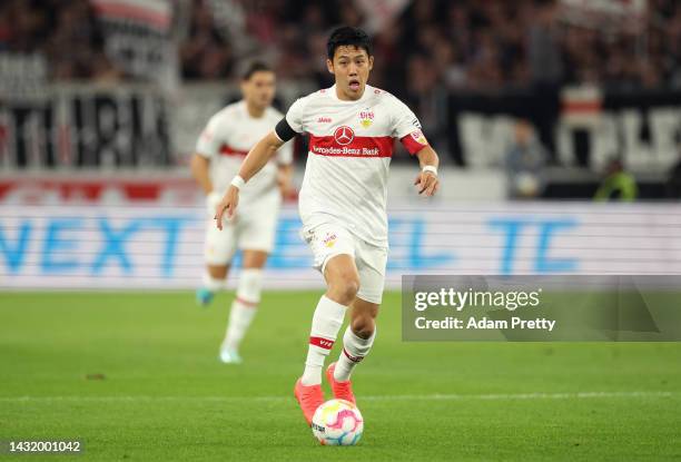 Wataru Endo of VfB Stuttgart runs with the ball during the Bundesliga match between VfB Stuttgart and 1. FC Union Berlin at Mercedes-Benz Arena on...