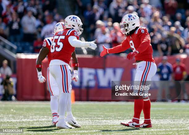 Matthew Judon of the New England Patriots celebrates with Josh Uche of the New England Patriots after a sack during the first half against the...