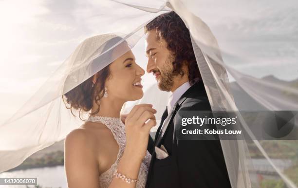 couple, love or wedding dress veil after marriage event, ceremony or union in nature environment. smile, happy or trust man or woman or bride and groom bonding after romance celebration by water lake - wedding couple stock pictures, royalty-free photos & images