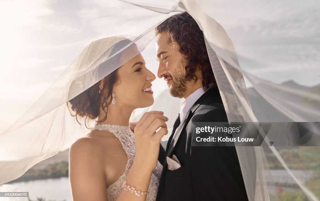 Couple, love or wedding dress veil after marriage event, ceremony or union in nature environment. Smile, happy or trust man or woman or bride and groom bonding after romance celebration by water lake