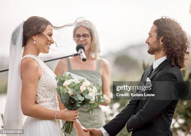 wedding, love and bride makes a promise to groom with a commitment oath and holding hands. couple, save the date and happy woman with a bouquet of flowers at her marriage celebration event outdoors - wedding people stock pictures, royalty-free photos & images