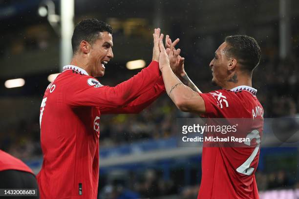 Cristiano Ronaldo celebrates with Antony of Manchester United after scoring their team's second goal during the Premier League match between Everton...