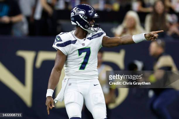 Geno Smith of the Seattle Seahawks reacts after a touchdown during the first half of the game against the New Orleans Saints at Caesars Superdome on...