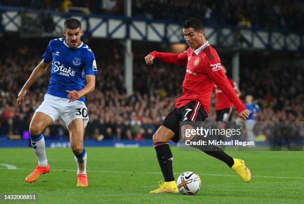 Cristiano Ronaldo of Manchester United celebrates after scoring their team's second goal during the Premier League match between Everton FC and...