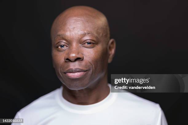 black man in his 60s with blue eyes - clean shaven face stock pictures, royalty-free photos & images