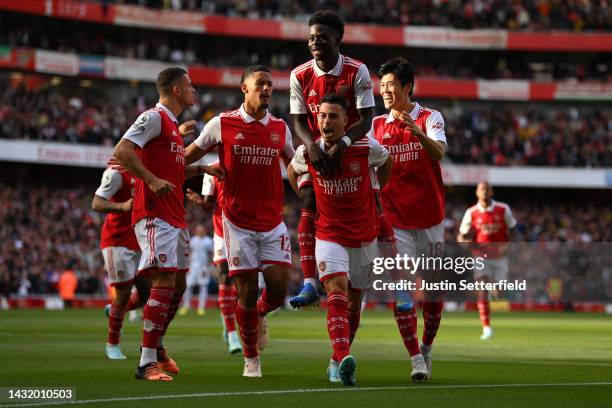 Gabriel Martinelli of Arsenal celebrates with teammates after scoring their team's first goal during the Premier League match between Arsenal FC and...