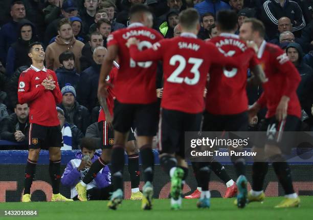 Cristiano Ronaldo of Manchester United celebrates scoring their second goal during the Premier League match between Everton FC and Manchester United...