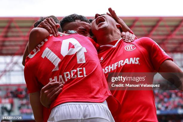 Marcel Ruiz of Toluca celebrates with his teammates after scoring his team's third goal during the playoff match between Toluca and FC Juarez as part...