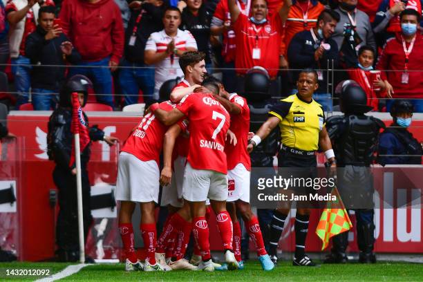 Marcel Ruiz of Toluca celebrates with teammates after scoring his team's third goal during the playoff match between Toluca and FC Juarez as part of...
