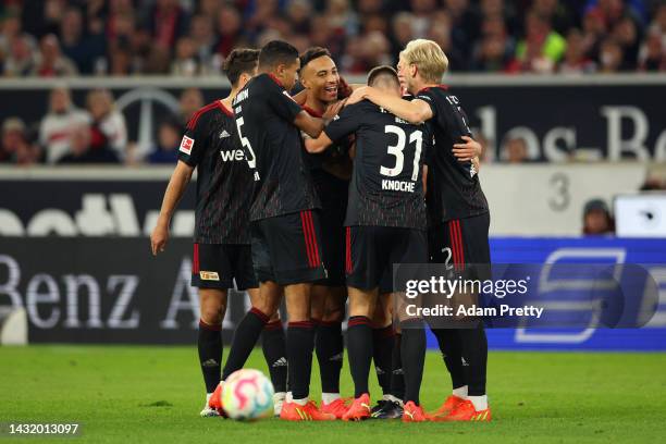 Paul Jaeckel celebrates with Julian Ryerson of 1.FC Union Berlin after scoring their team's first goal during the Bundesliga match between VfB...