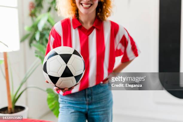 close up of female football fan wearing sports jersey, cheering for her national team at the world championship - football scarf stock pictures, royalty-free photos & images