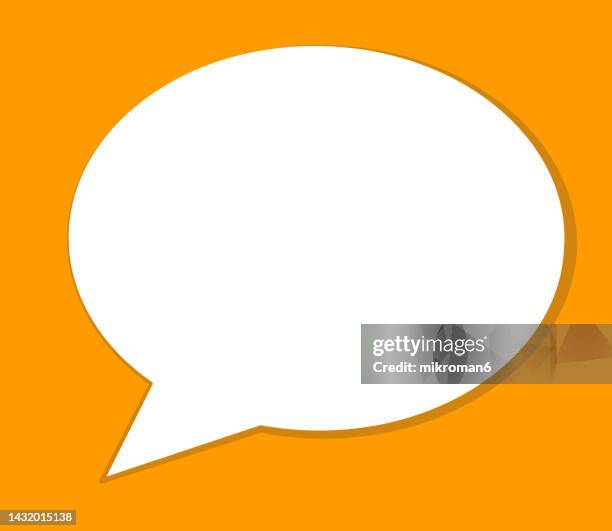 speech bubble on yellow backgorunds - text conversation stock pictures, royalty-free photos & images