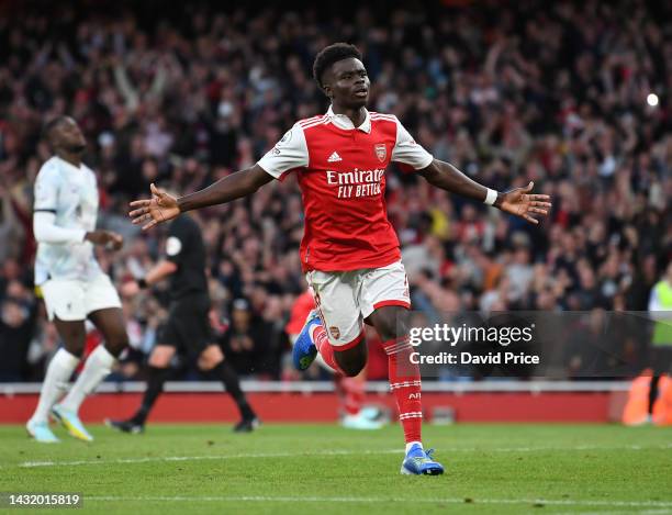 Bukayo Saka celebrates scoring Arsenal's 3rd goal during the Premier League match between Arsenal FC and Liverpool FC at Emirates Stadium on October...