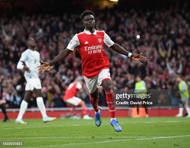 Bukayo Saka celebrates scoring Arsenal's 3rd goal during the Premier League match between Arsenal FC and Liverpool FC at Emirates Stadium on October...