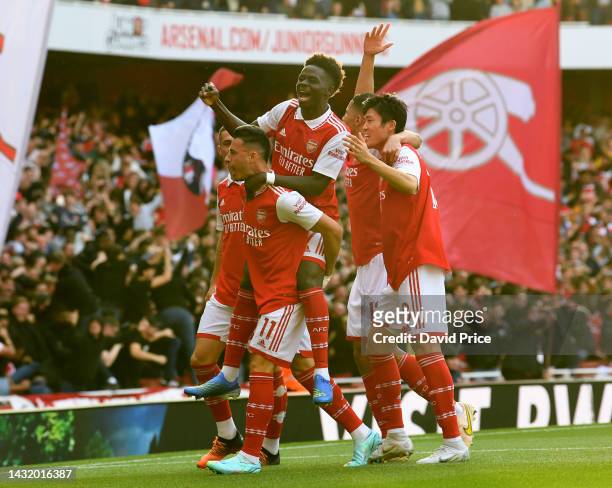 Gabriel Martinelli celebrates scoring Arsenal's 1st goal with Bukayo Saka during the Premier League match between Arsenal FC and Liverpool FC at...