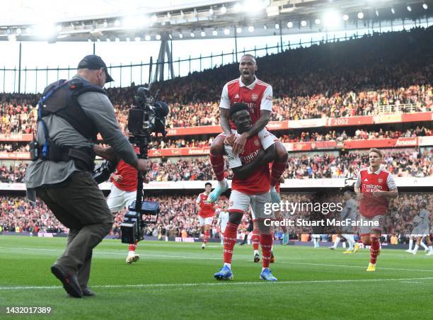 Bukayo Saka celebrates scoring the 2nd Arsenal goal with Gabriel during the Premier League match between Arsenal FC and Liverpool FC at Emirates...