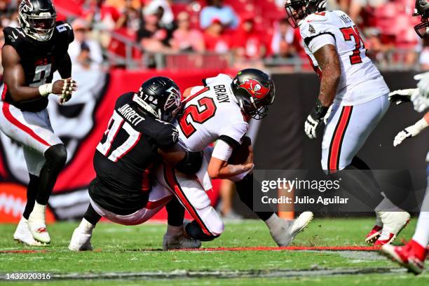 Grady Jarrett of the Atlanta Falcons sacks Tom Brady of the Tampa Bay Buccaneers during the fourth quarter of the game at Raymond James Stadium on...