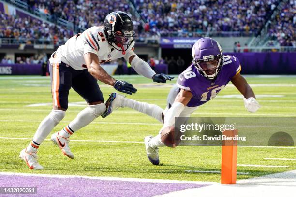 Justin Jefferson of the Minnesota Vikings dives for a conversion against Jaylon Jones of the Chicago Bears during the fourth quarter at U.S. Bank...