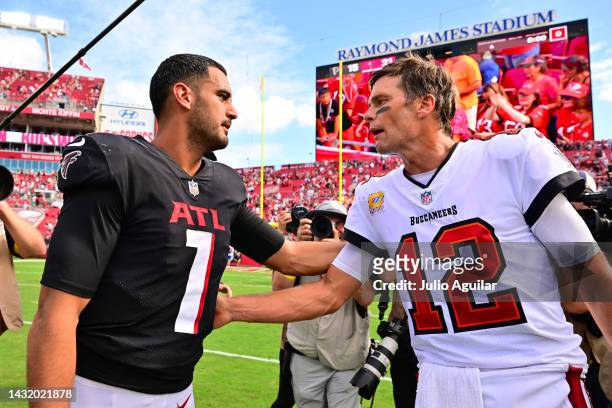 Marcus Mariota of the Atlanta Falcons greets Tom Brady of the Tampa Bay Buccaneers following the game at Raymond James Stadium on October 09, 2022 in...