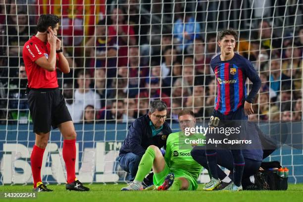 Marc-Andre ter Stegen of FC Barcelona receives medical treatment during the LaLiga Santander match between FC Barcelona and RC Celta at Spotify Camp...