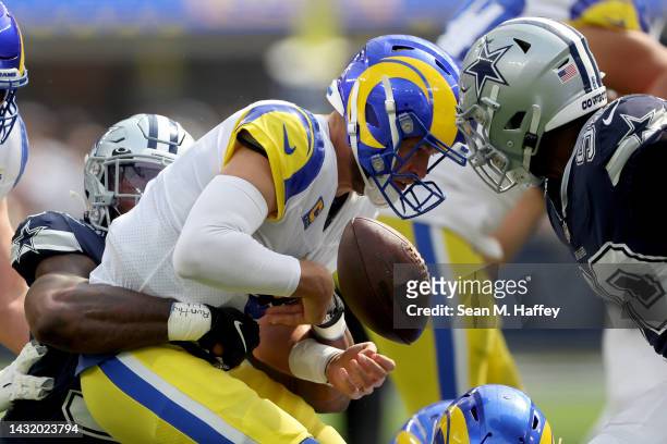 Quinton Bohanna of the Dallas Cowboys forces a fumble on Matthew Stafford of the Los Angeles Rams during the first quarter at SoFi Stadium on October...
