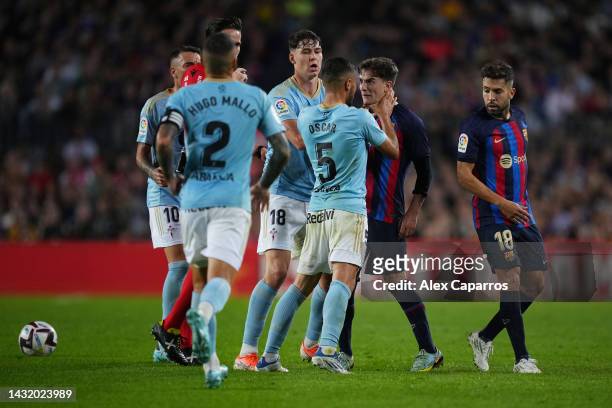 Oscar Rodriguez of Celta Vigo clashes with Gavi of FC Barcelona during the LaLiga Santander match between FC Barcelona and RC Celta at Spotify Camp...