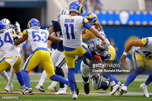 Dorance Armstrong of the Dallas Cowboys blocks a punt by Riley Dixon of the Los Angeles Rams during the first quarter at SoFi Stadium on October 09,...