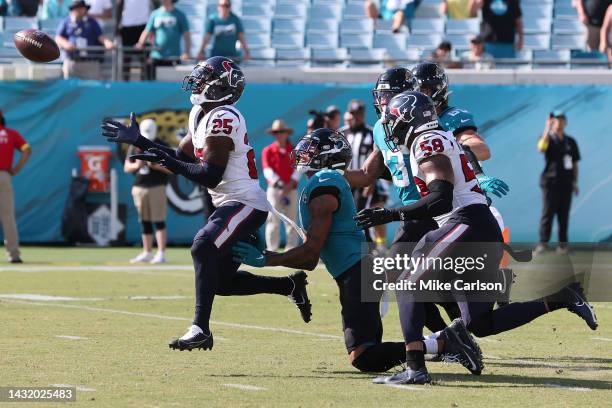 Desmond King II of the Houston Texans intercepts the ball intended for Marvin Jones Jr. #11 of the Jacksonville Jaguars during the second half of the...