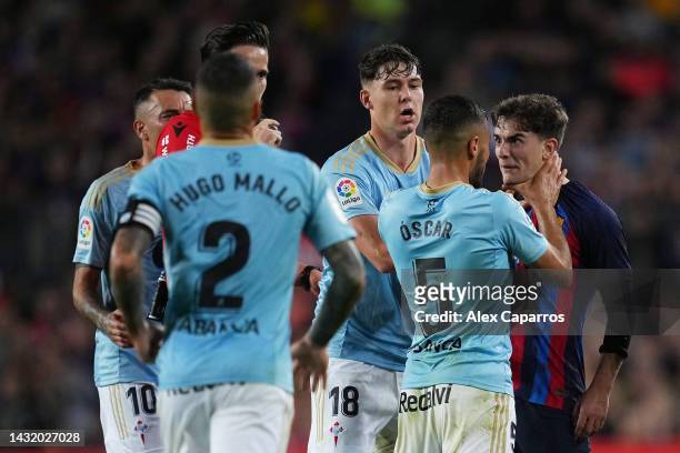 Oscar Rodriguez of Celta Vigo clashes with Gavi of FC Barcelona during the LaLiga Santander match between FC Barcelona and RC Celta at Spotify Camp...