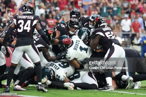 Jalen Hurts of the Philadelphia Eagles scores a touchdown during the second quarter against the Arizona Cardinals at State Farm Stadium on October...