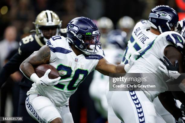 Rashaad Penny of the Seattle Seahawks runs with the ball against the New Orleans Saints at Caesars Superdome on October 09, 2022 in New Orleans,...