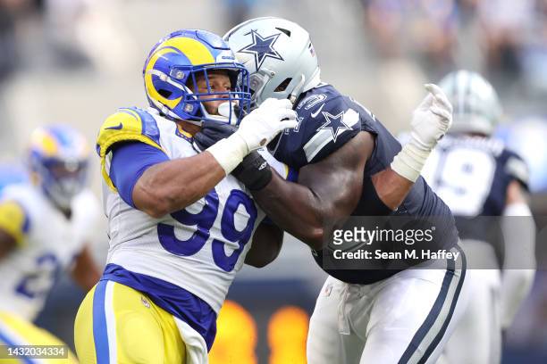 Tyler Smith of the Dallas Cowboys defends against the pass rush of Aaron Donald of the Los Angeles Rams during the second quarter at SoFi Stadium on...