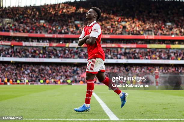 Bukayo Saka of Arsenal celebrates after scoring a goal to make it 2-1during the Premier League match between Arsenal FC and Liverpool FC at Emirates...