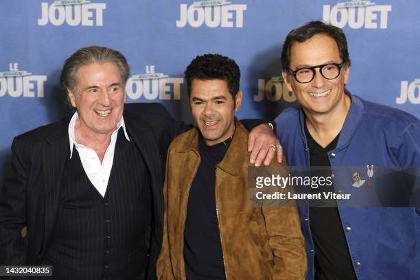 Daniel Auteuil, Jamel Debbouze and James Huth attend the "Le Nouveau Jouet" premiere at Le Grand Rex on October 09, 2022 in Paris, France.