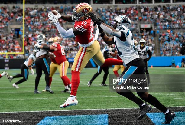 Deebo Samuel of the San Francisco 49ers completes the pass for a touchdown during the third quarter of the game against the Carolina Panthers at Bank...