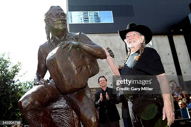 Musician Willie Nelson poses after the unveiling of his statue at ACL Live on April 20, 2012 in Austin, Texas.