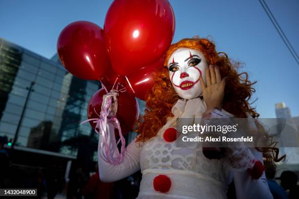 Abigail Lowder dressed as Pennywise poses outside New York Comic Con 2022 on October 09, 2022 in New York City. The four-day event, which began...