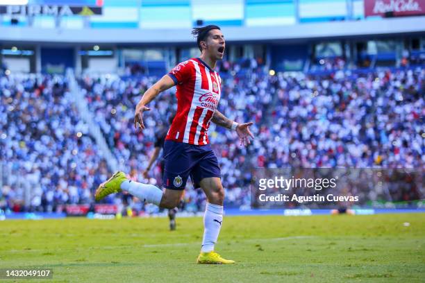 Carlos Cisneros of Chivas celebrates after scoring the first goal of his team during the playoff match between Puebla and Chivas as part of the...